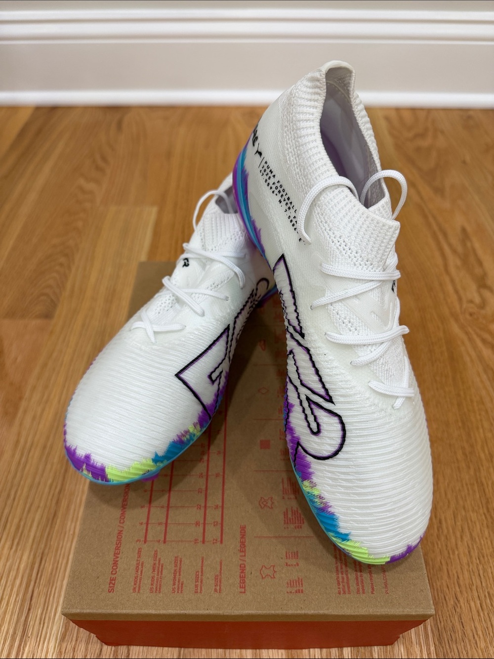 Woman White Soccer Cleats with Rainbow Accents size 7 -box no lid